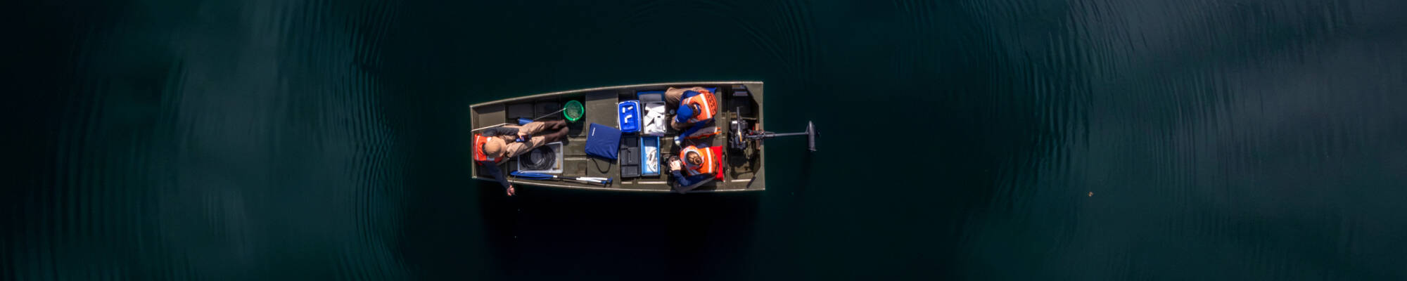 (Clockwise from left) Mya Harmer, Alexis Porter and Katie Tyrrell, staff members with the Steinman Lab, take a boat onto Nichols Lake in Newaygo County on June 24. They are working as part of AWRI’s inland lake salt survey. (Photo releases on file)